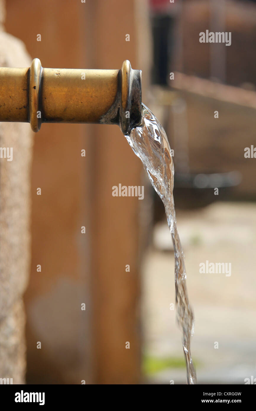 Water pouring out of a well, Castelbuono, Sicily, Italy, Europe Stock Photo