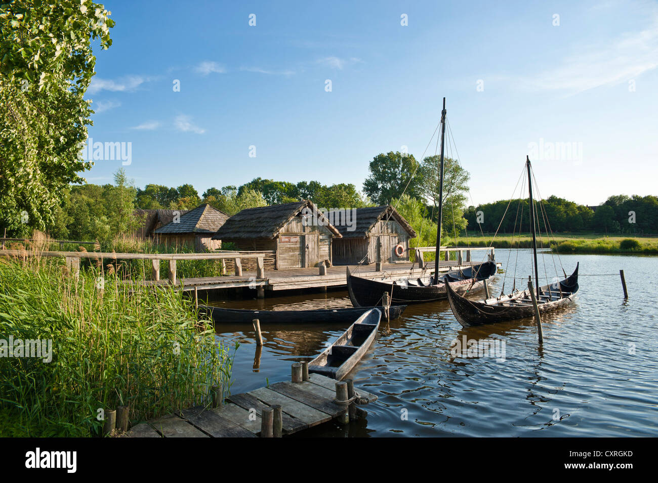 Wallmuseum, Slavic village with a Viking ship, a Slavic merchant ship and a logboat, Oldenburg in Holstein, Baltic Sea Stock Photo