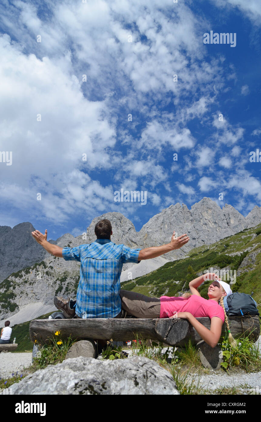 Hikers taking a break at Gruttenhuette hut, Mt Ellmauer Halt, Wilder Kaiser massif, Tyrol, Austria, Europe Stock Photo