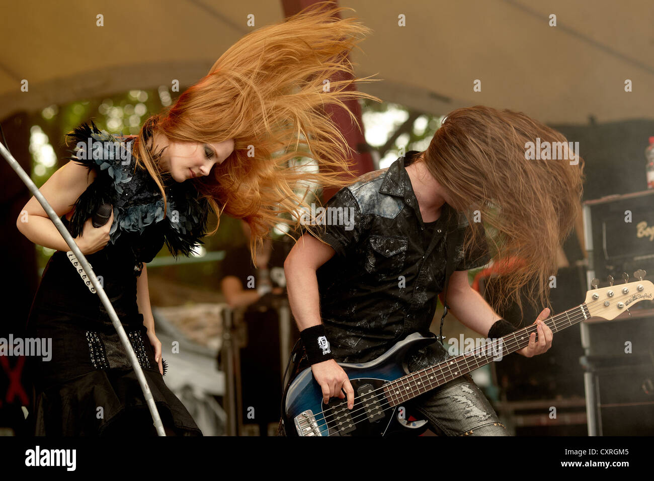 Simone Simons, singer of the Dutch symphonic metal band 'Epica' with bass-guitarist Rob van der Loo playing at the Metalfest Stock Photo