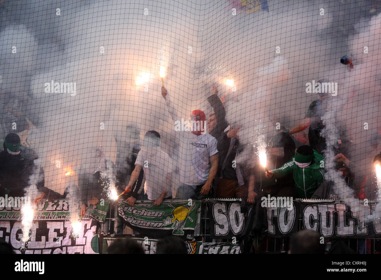 Fans of Borussia Moenchengladbach have ignited fireworks and flares during the match FSV Mainz 05 vs Borussia Moenchengladbach Stock Photo