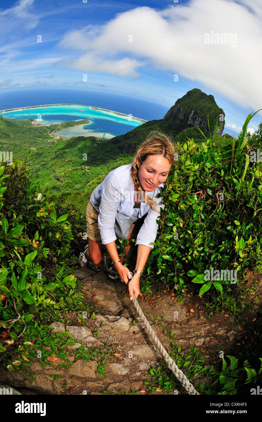 Woman hiking on Mount Pahia, Bora Bora, Leeward Islands, Society