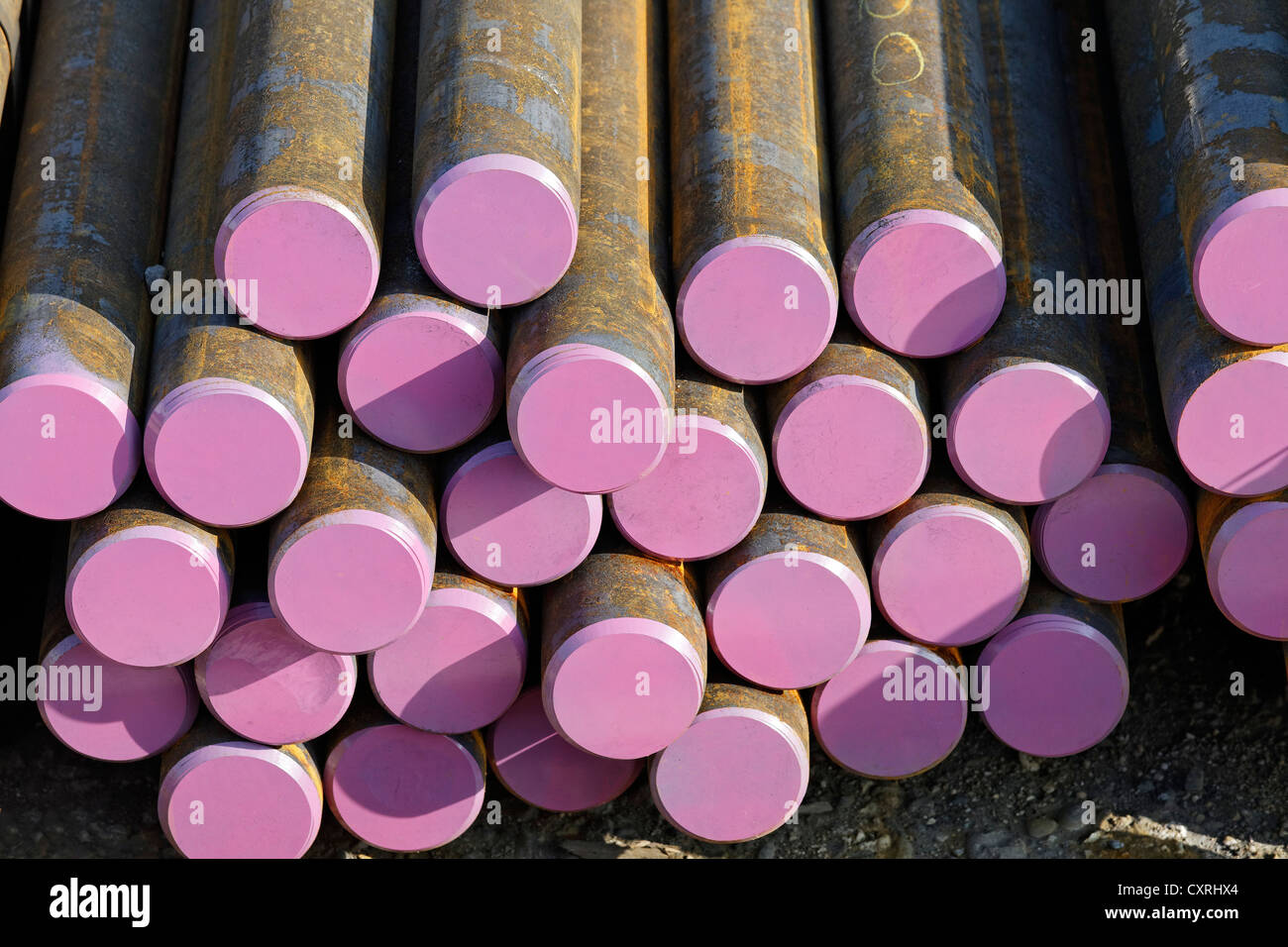 Round steel bars with coloured markings, storage yard of a steel trader, Port of Neuss