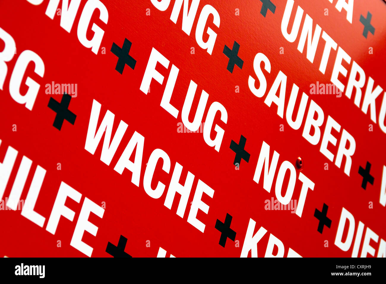 Keywords, white lettering on red, on an used clothes container, Berlin, Germany, Europe Stock Photo