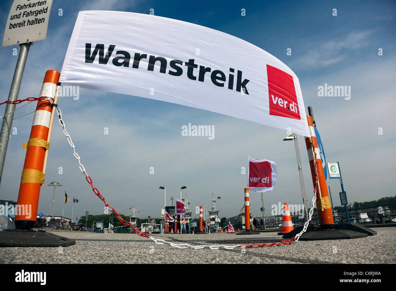 Banner and flag of the union 'Verdi' at a warning strike at the ferry terminal of the port, Travemuende, Schleswig-Holstein Stock Photo