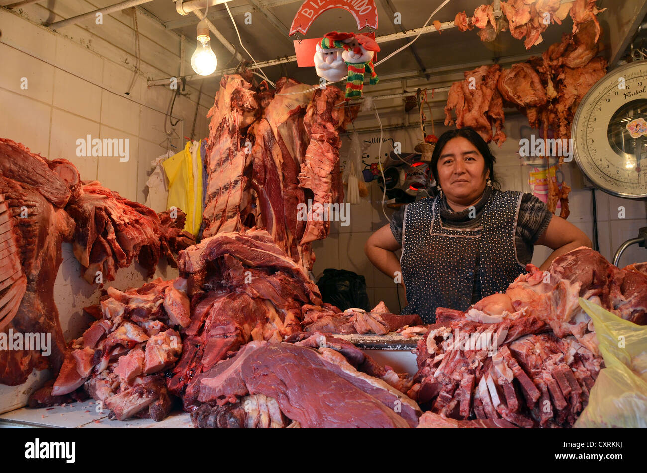 Saleswoman at a rustic meat counter, La Paz, Bolivia, South America Stock Photo