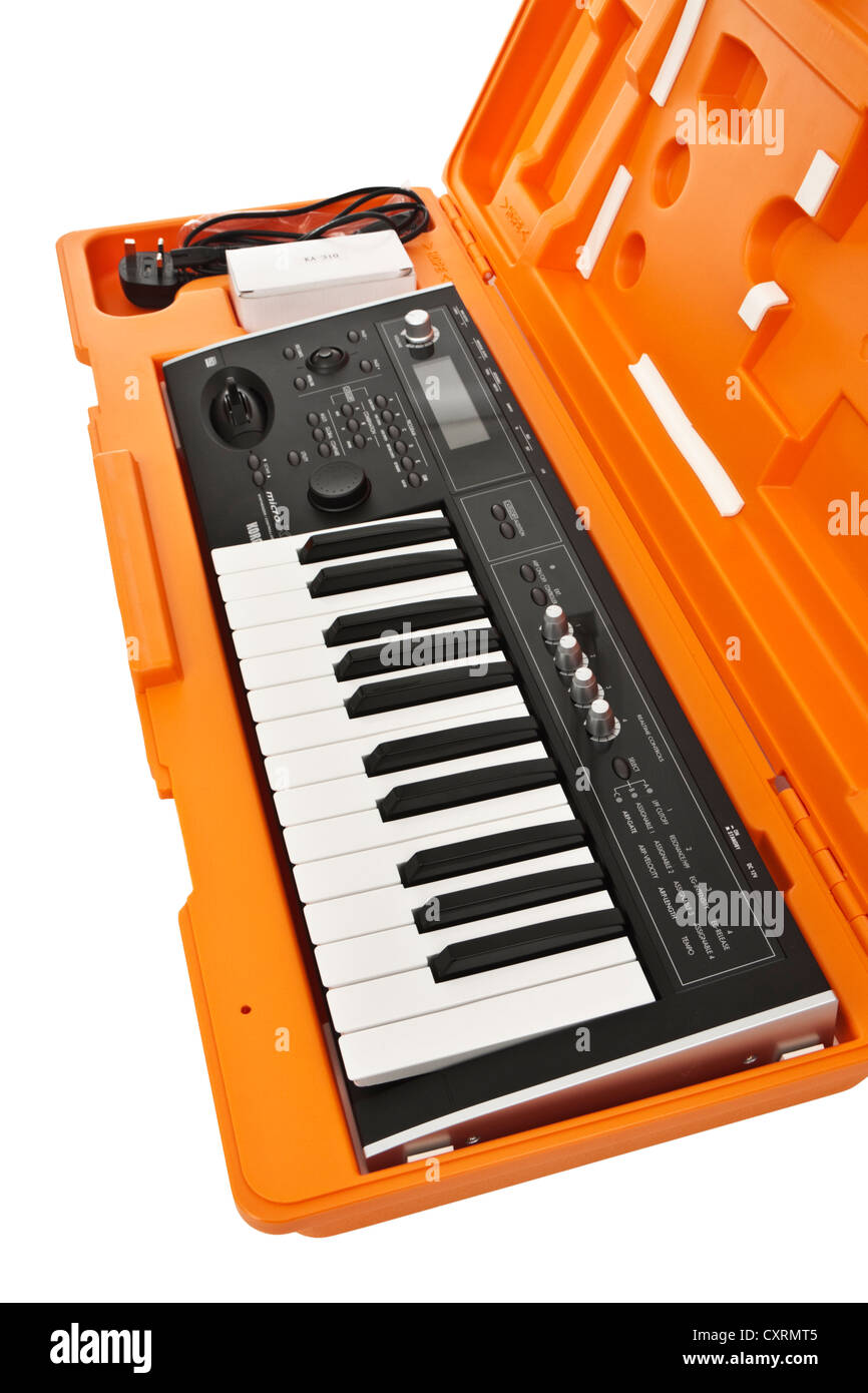 2006 Korg Micro X portable 25-key music synthesizer / controller in orange hard case Stock Photo