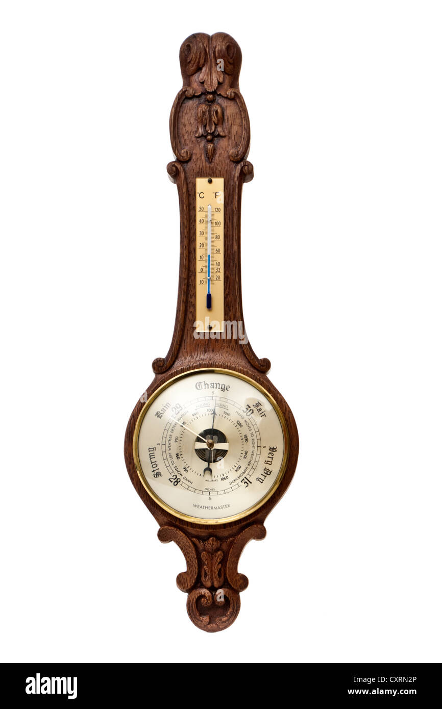 Weathermaster barometer and thermometer in carved wooden housing Stock