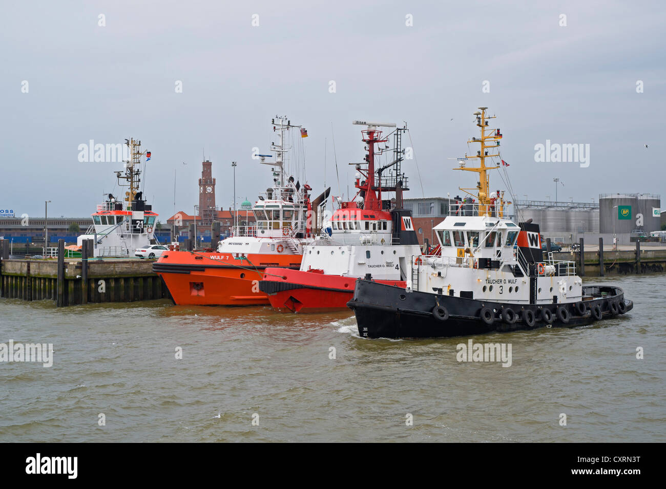 Taucher O. Wulf and various tug boats in the port of Cuxhaven, Lower Saxony, Germany, Europe, PublicGround Stock Photo