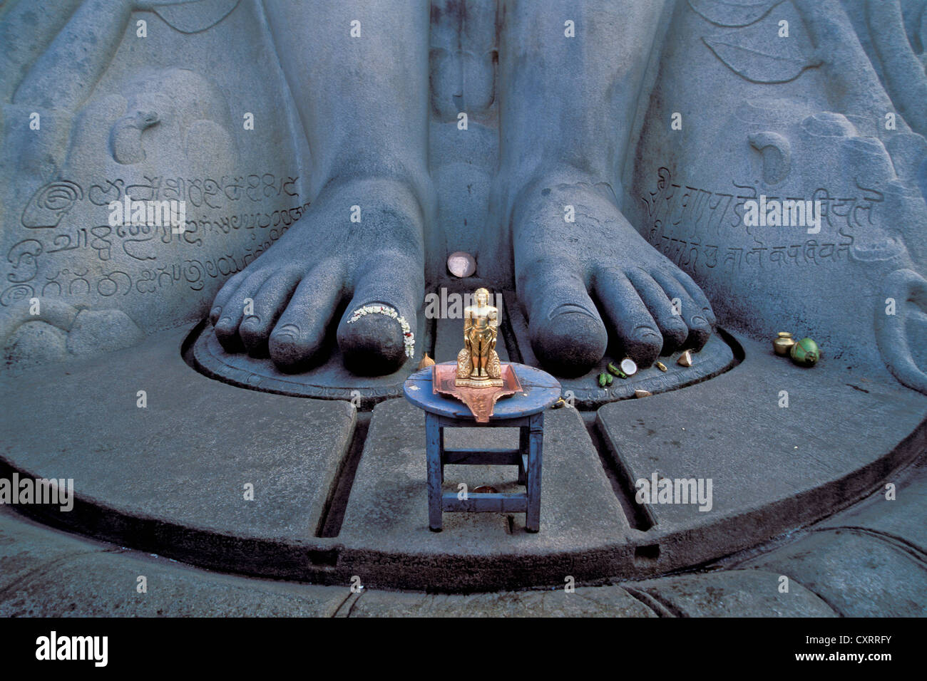 Feet, miniature statue at the foot of the large Jain statue of Gomateshwara, Indragiri Hill, Sravanabelagola, Hassan district Stock Photo