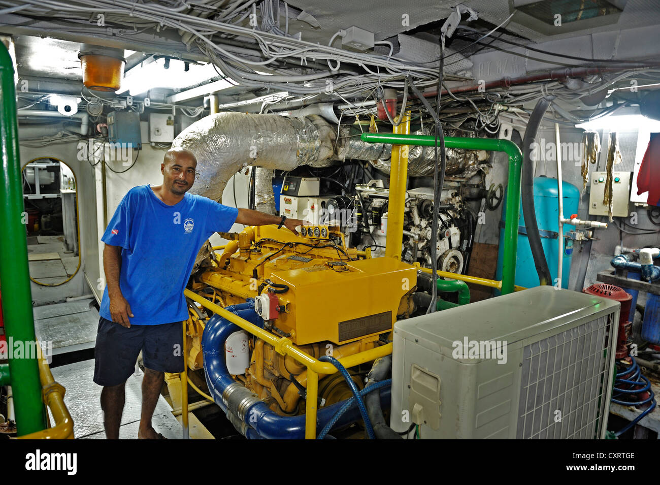Machinist working in the engine room of a ship, Okeanoss Aggressor, Costa Rica, Central America Stock Photo