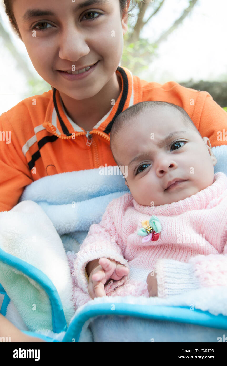 Egyptian girl and her baby sister Egypt Stock Photo Alamy