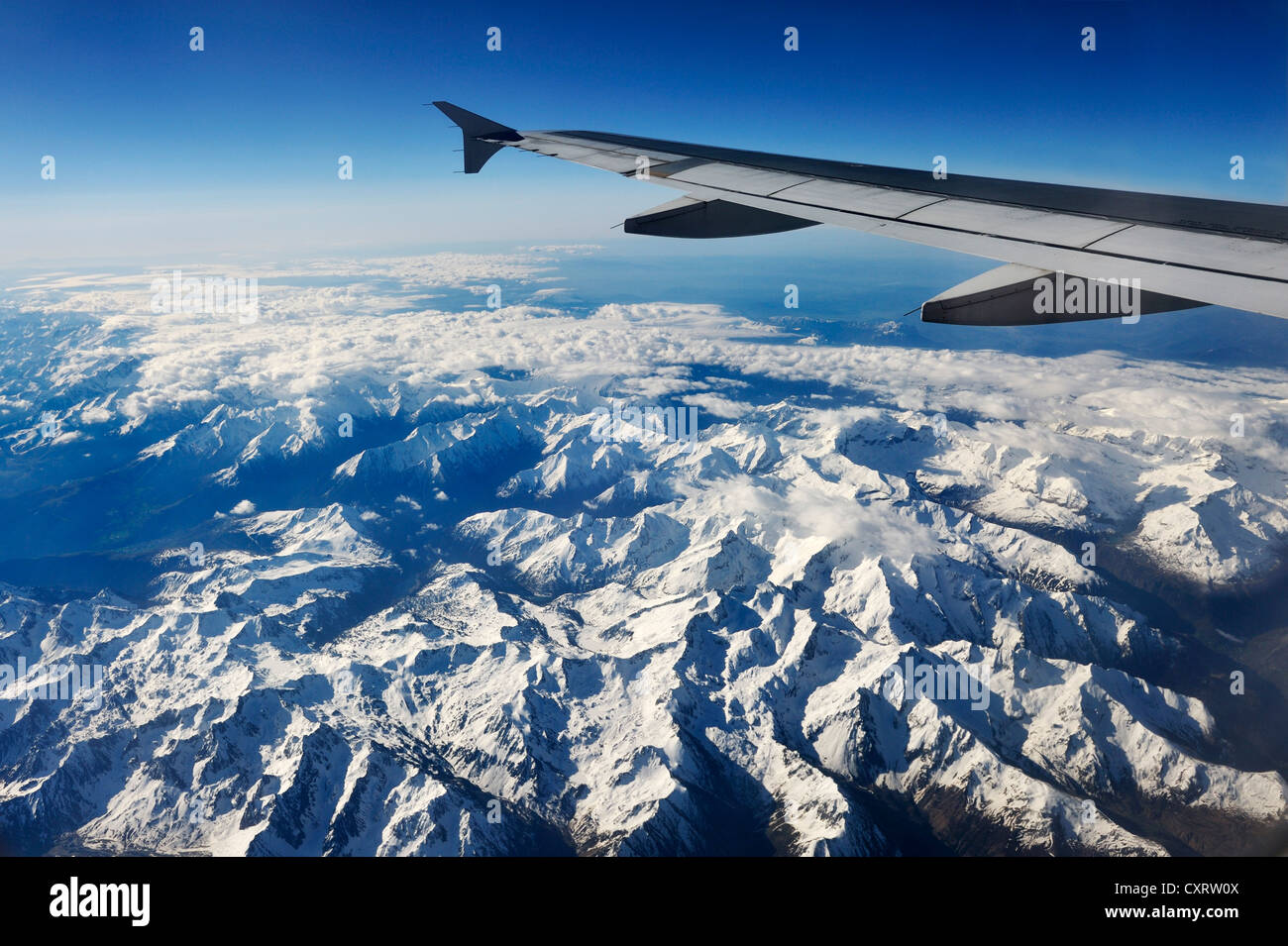 View from an airplane during the flight from Frankfurt to Madrid, French  alps under the wing of the plane Stock Photo - Alamy