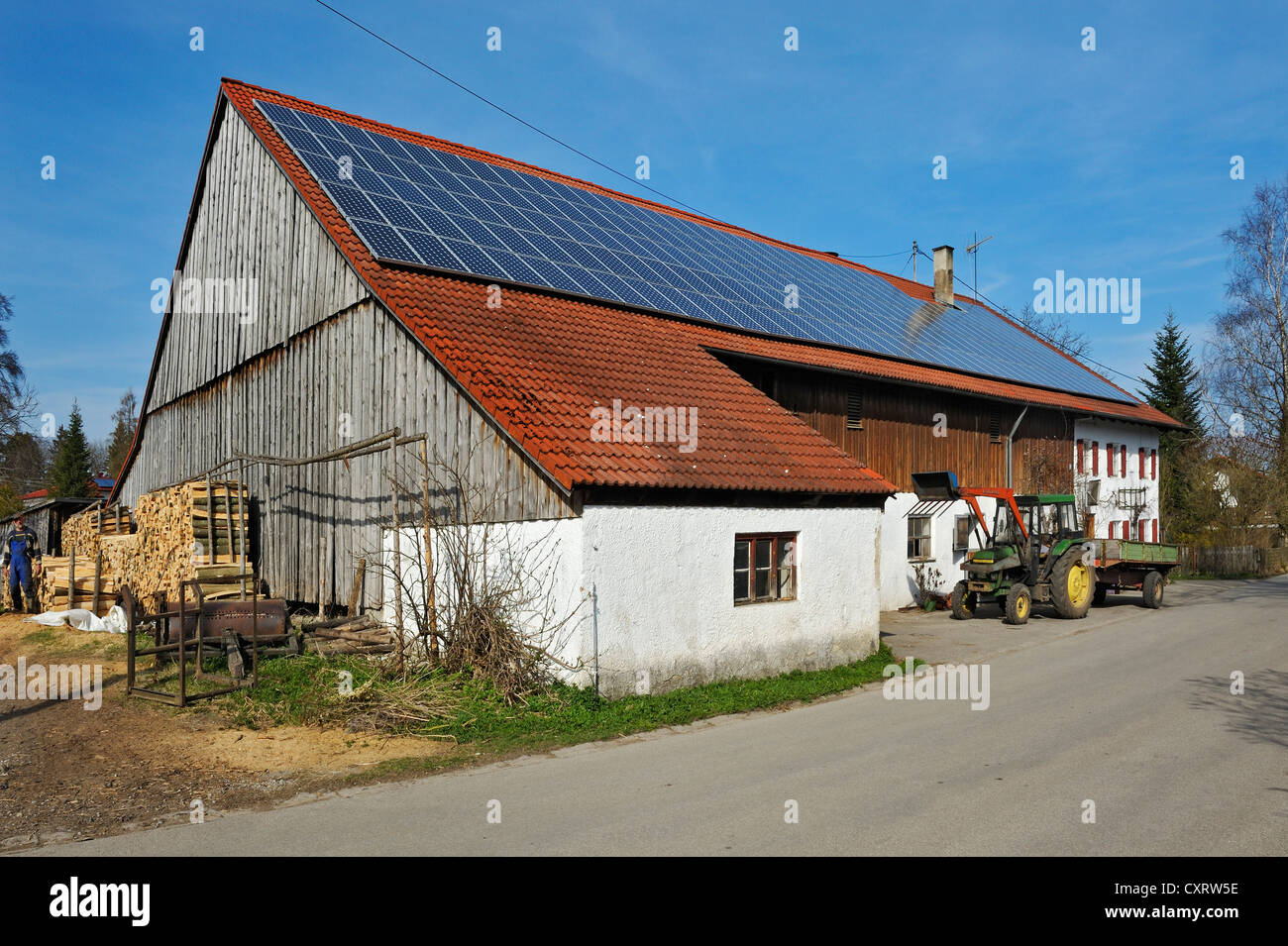 Farm with solar panels on the roof, near Diessen on Lake Ammer, Bavaria, Germany, Europe Stock Photo