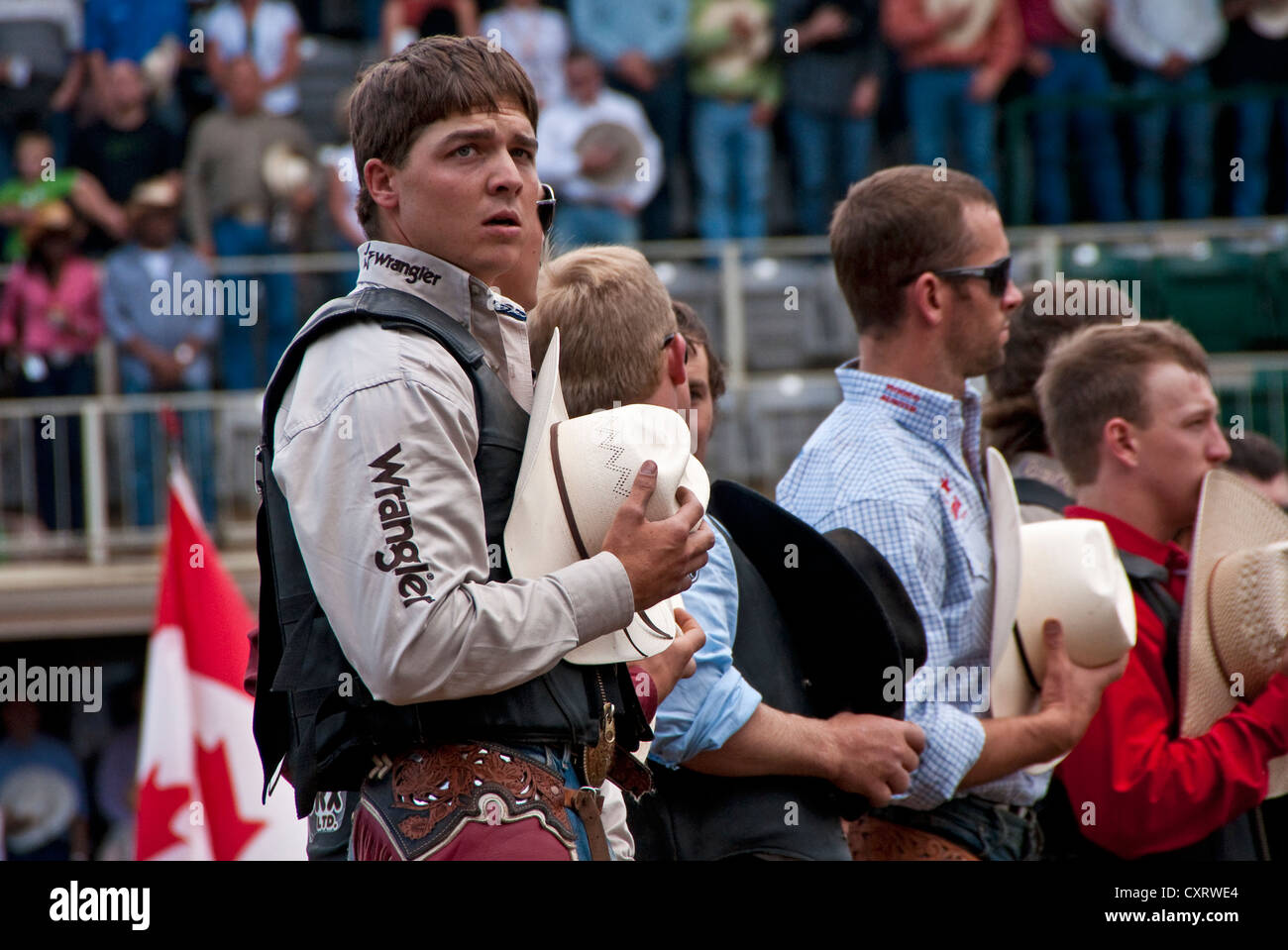 Calgary Stampede 2012 rodeo contestants during playing of O Canada prior to program event. Stock Photo