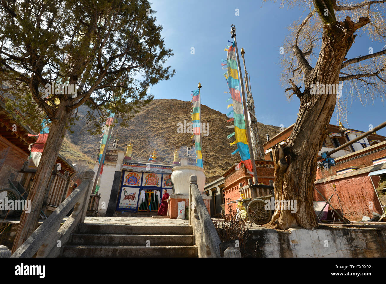 Tibetan Buddhism, stupa and monastery buildings with prayer flags built in the traditional architectural style Stock Photo