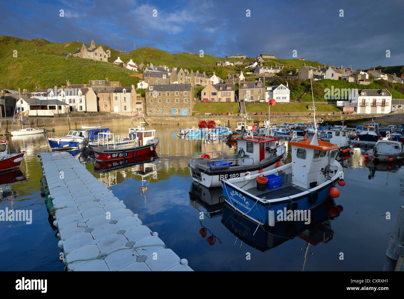 Houses and harbour with fishing boats in Gardenstown, Banffshire