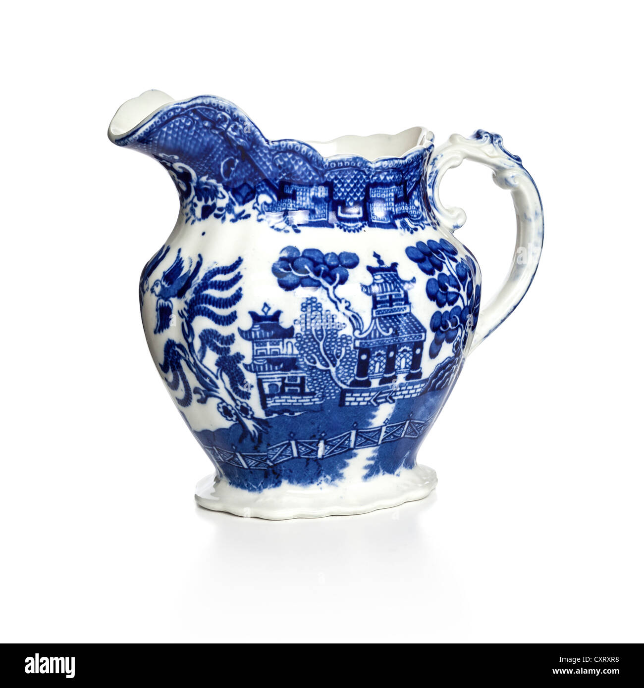 Blue Willow pattern jug on white background with soft shadow at base Stock Photo