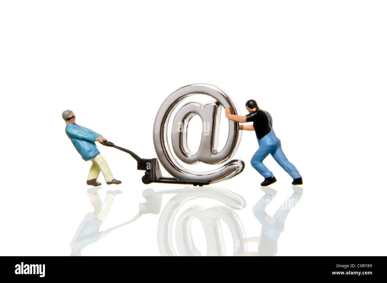 Two workers, miniature figures moving an at sign on a lifting cart, symbolic image Stock Photo