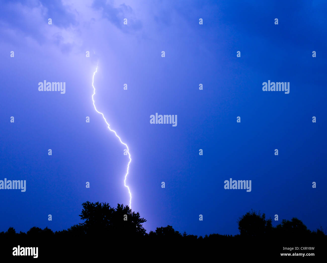 Single bolt of lightning in a thunderstorm. Stock Photo