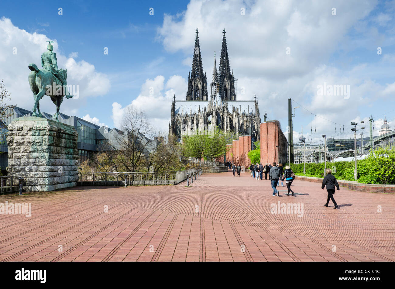 View across Heinrich-Boell-Platz square towards Cologne Cathedral, equestrian statue of Kaiser Wilhelm II on the left, Cologne Stock Photo