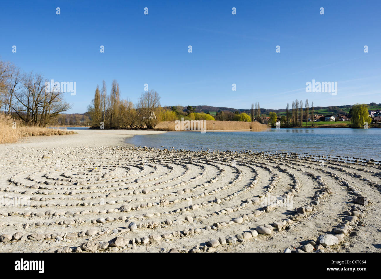 Stone labyrinth on Werd island, can be used for meditation, Werd island at the back, Canton of Schaffhausen, Switzerland, Europe Stock Photo