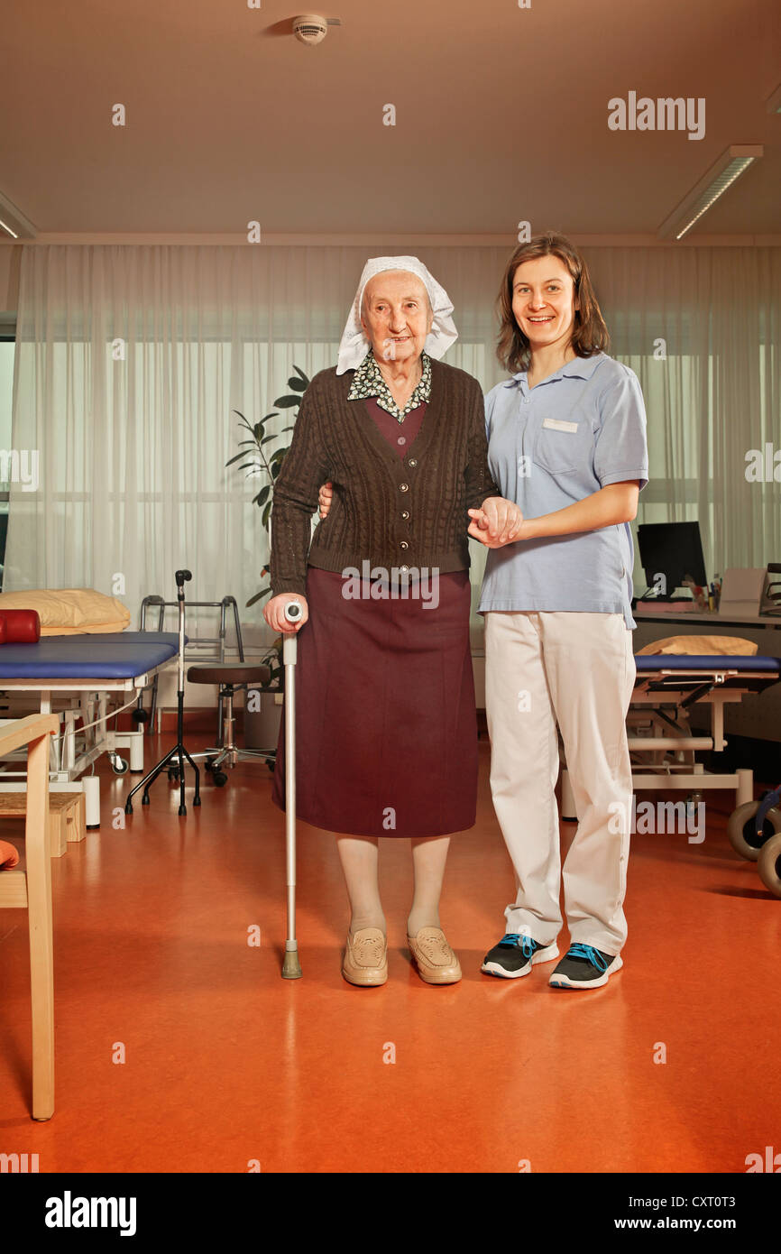 Old woman with a physiotherapist Stock Photo