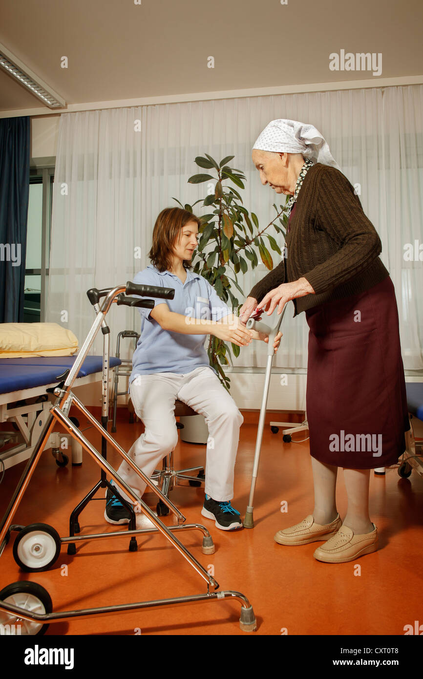 Old woman with a physiotherapist Stock Photo