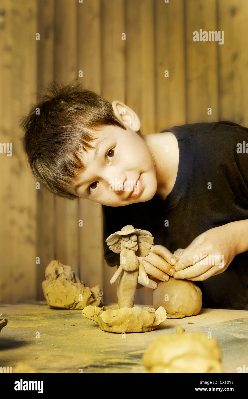 Boy clay modelling Stock Photo Alamy