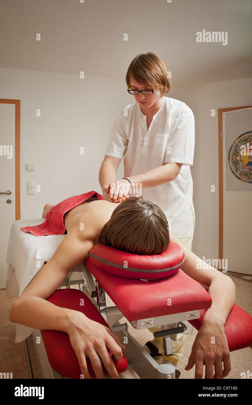 Patient getting a therapeutic massage, massage therapist Stock Photo