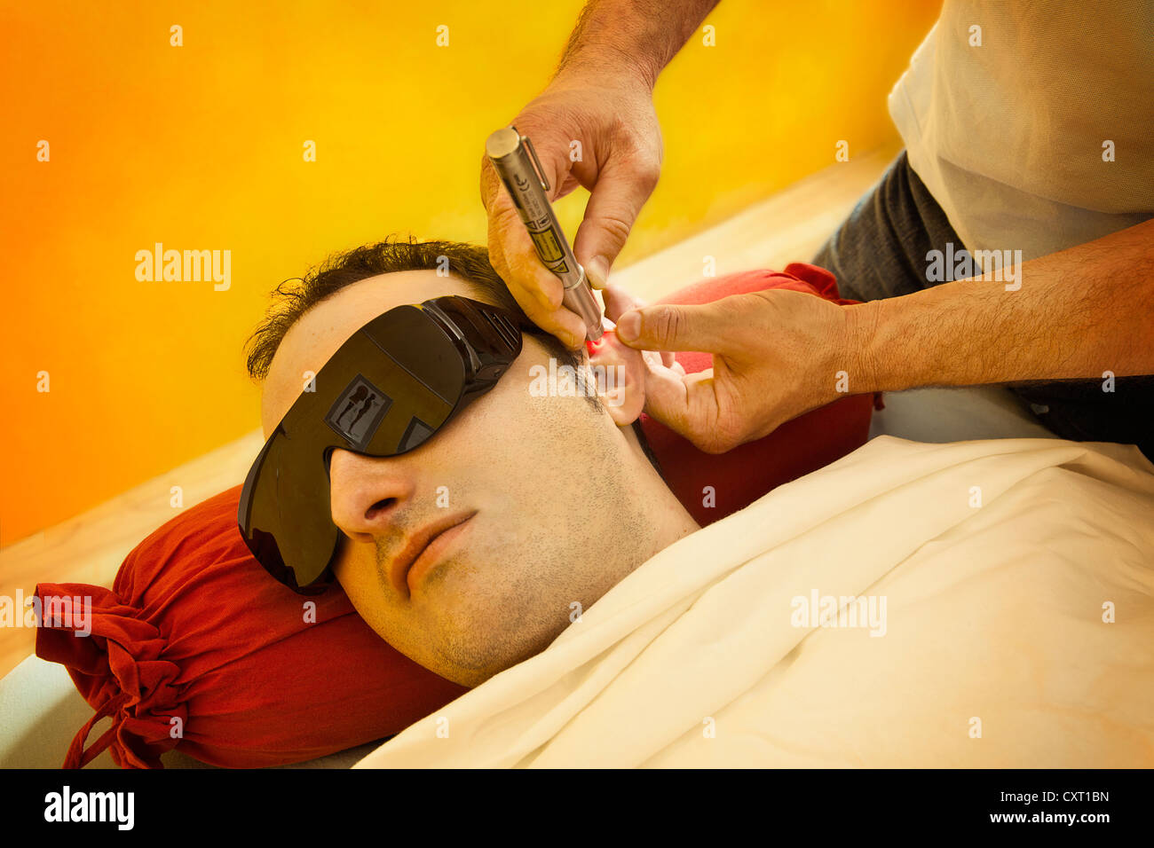 Laser treatment, patients wearing safety glasses Stock Photo