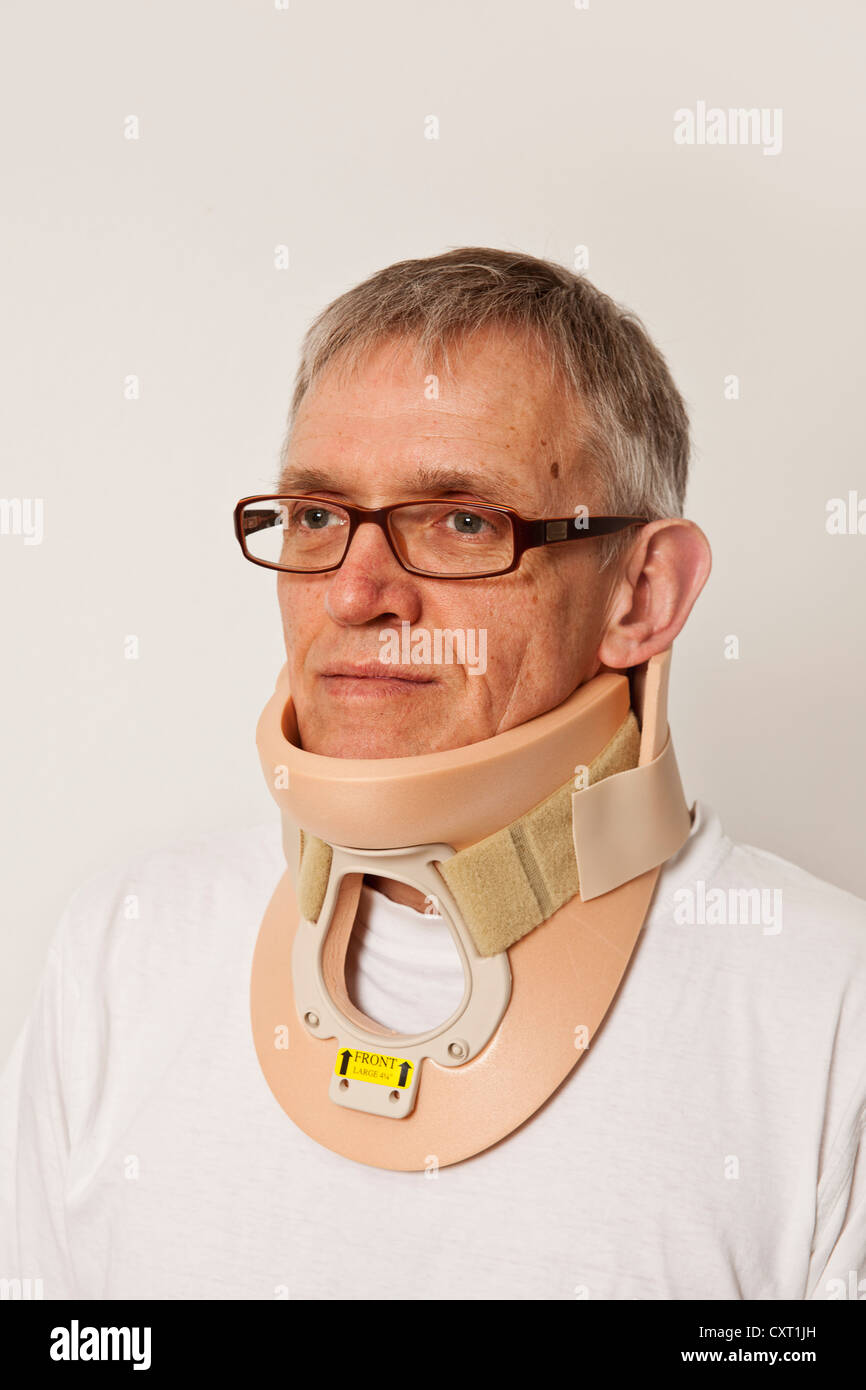 Man wearing a neck support, cervical brace Stock Photo