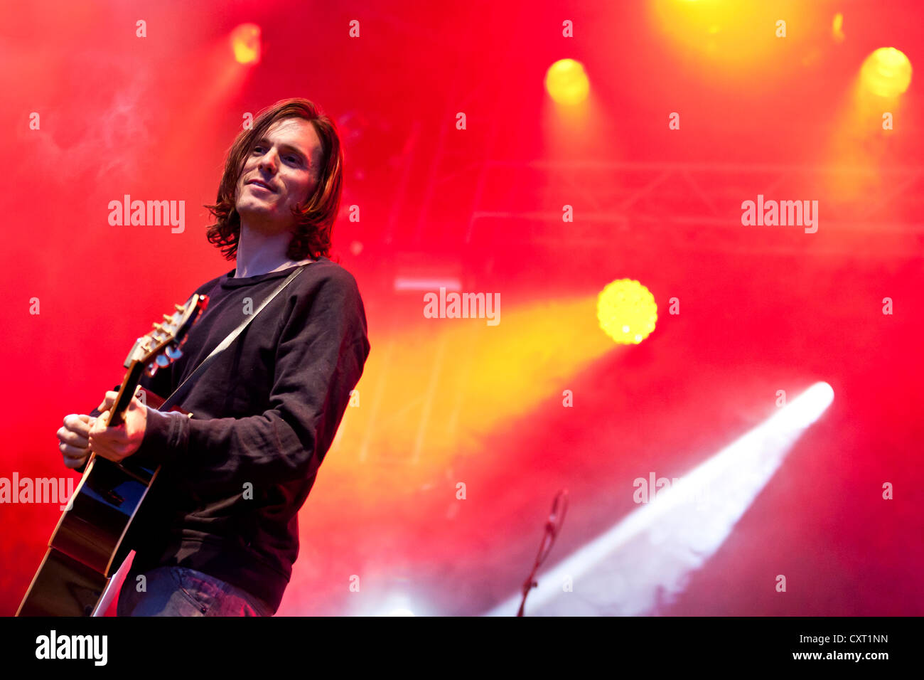 Adrian Sieber, lead singer of the Swiss pop band Lovebugs playing live ...