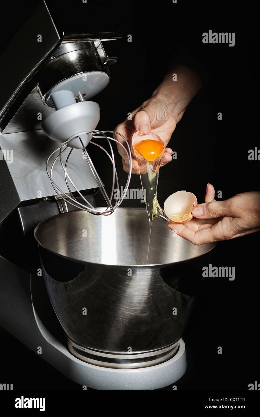 Eggs are cracked, mixing bowl Stock Photo
