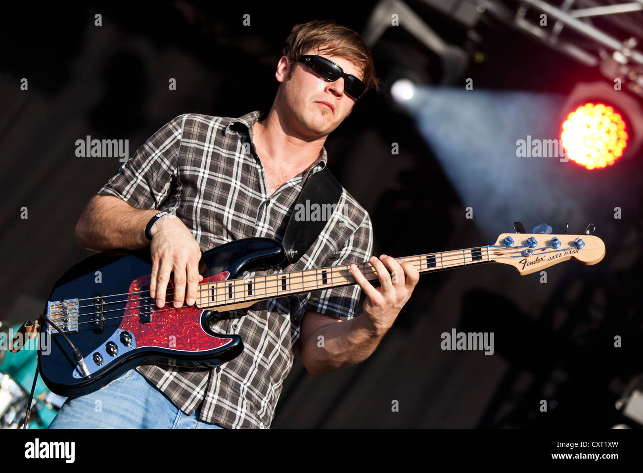 Helmuth Fass, bass guitarist of the German reggae band Sebastian Sturm & Exile Airline, playing live at Soundcheck Open Air in Stock Photo