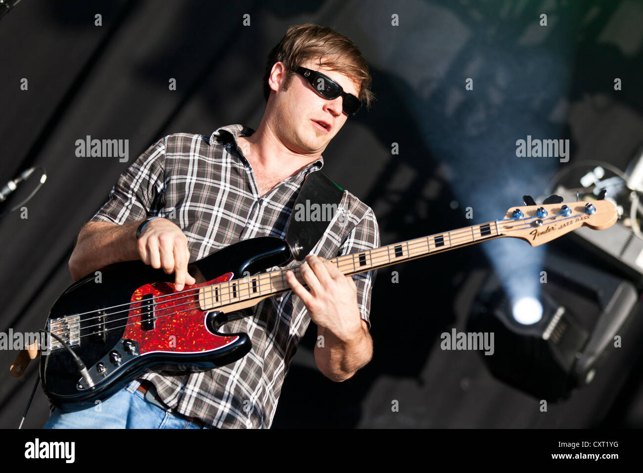 Helmuth Fass, bass guitarist of the German reggae band Sebastian Sturm & Exile Airline, playing live at Soundcheck Open Air in Stock Photo