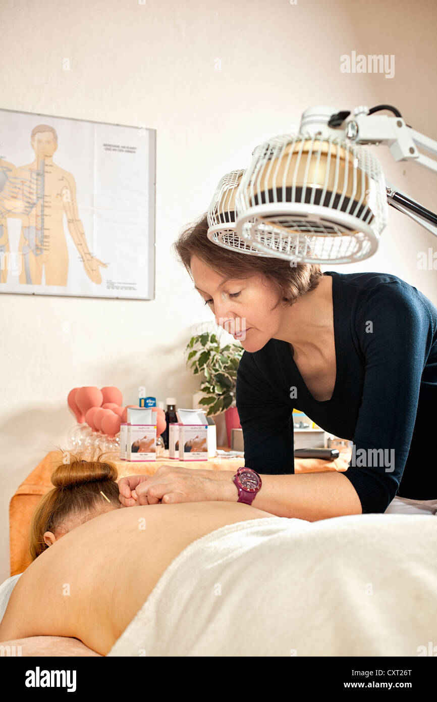 Acupuncture treatment, Traditional Chinese Medicine, heat lamp Stock