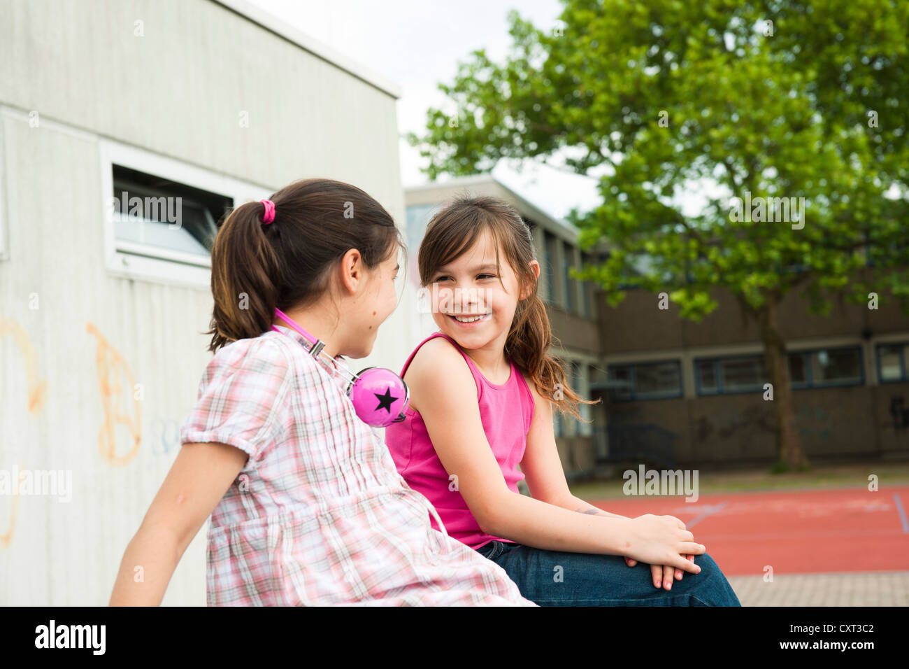 Two girls talking to each other Stock Photo Alamy