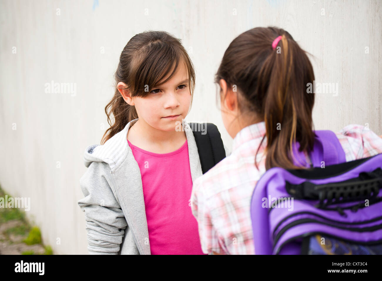 Two girls looking agressively at each other Stock Photo