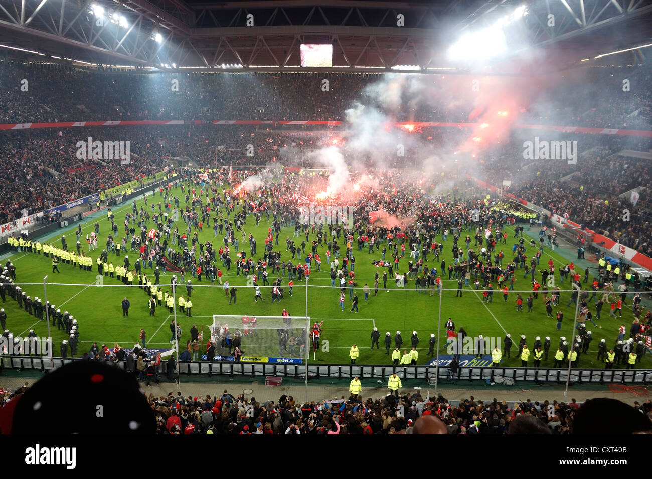 Fans during a pitch invasion, rioting on the pitch, during the relegation match Fortuna Duesseldorf vs. Herta BSC Berlin Stock Photo