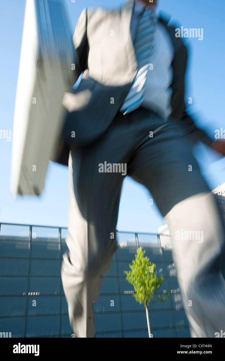 Businessman hurrying frantically to an appointment Stock Photo
