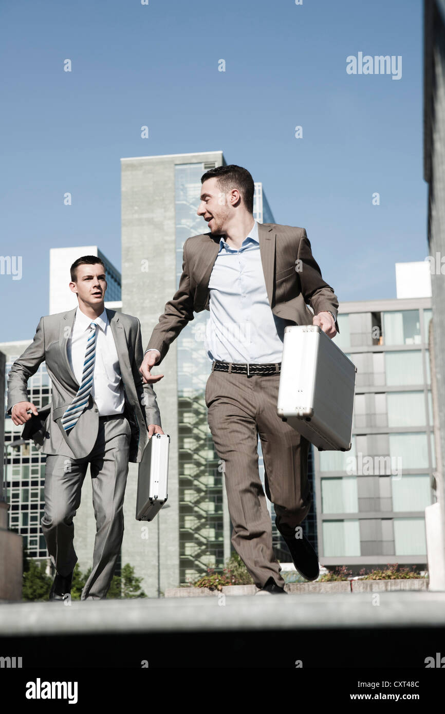 Two businessmen rushing to an appointment Stock Photo