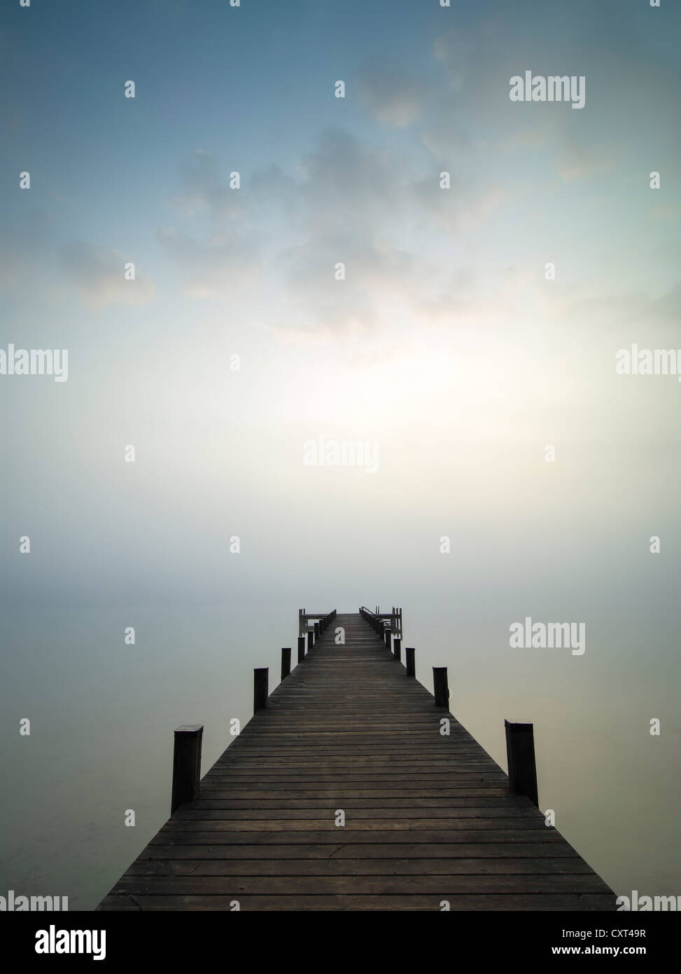 Jetty on lake Woerthsee in the fog, Bavaria, Germany, Europe Stock Photo