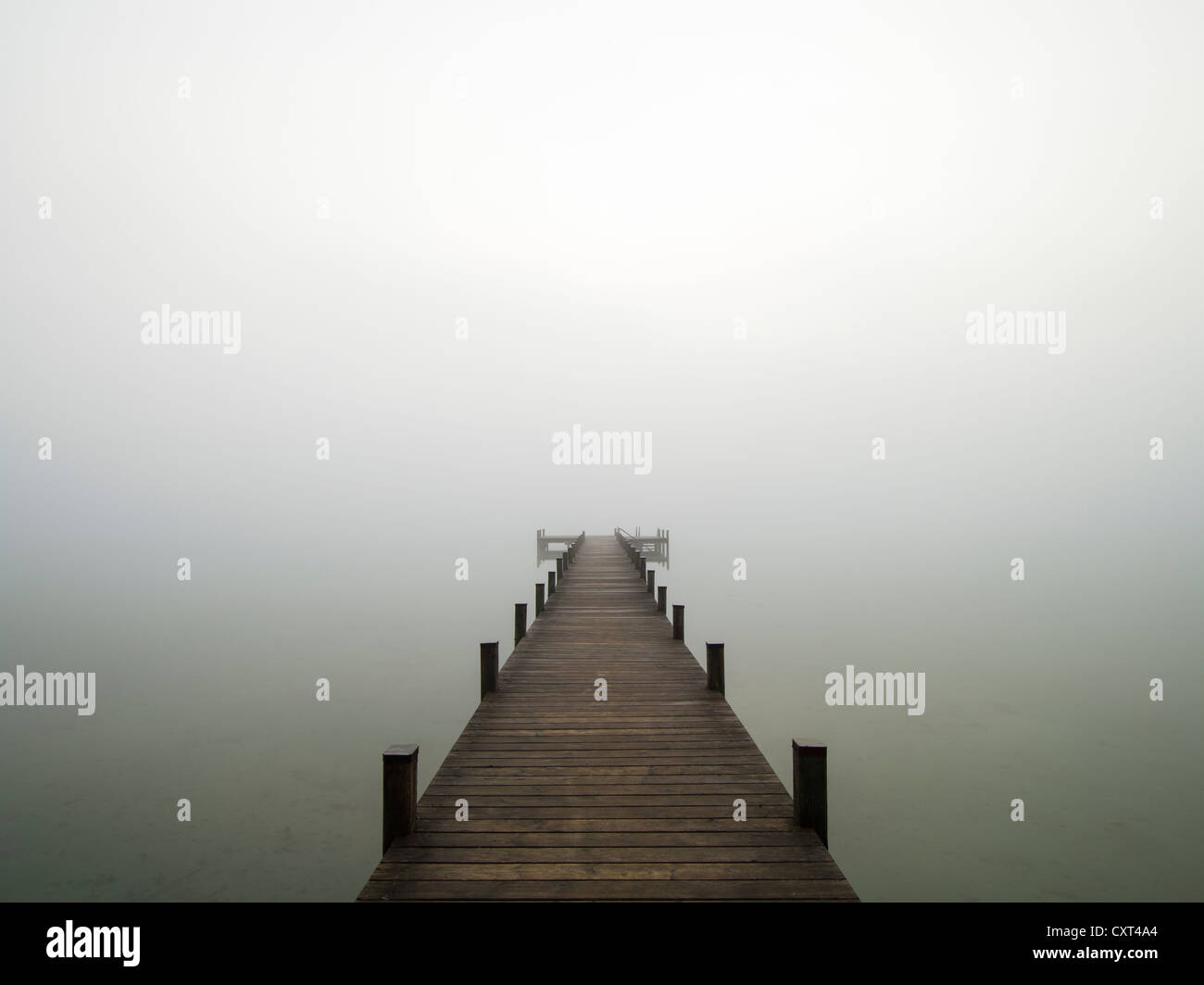 Jetty on lake Woerthsee in the fog, Bavaria, Germany, Europe Stock Photo