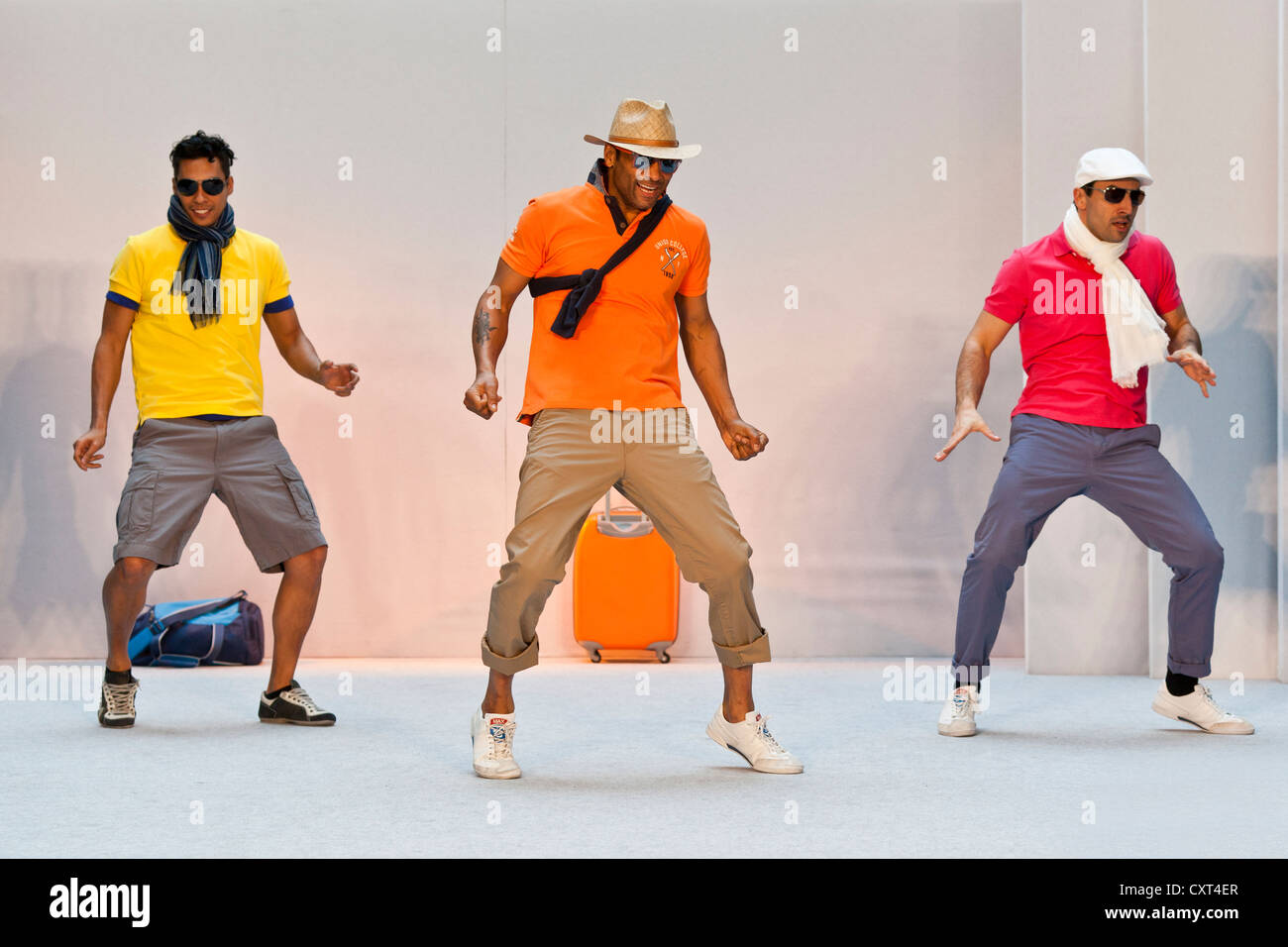 3 young men, models performing in the Spring and Summer Fashion Show 2012 in Pilatusmarkt in Kriens, Lucerne, Switzerland Stock Photo
