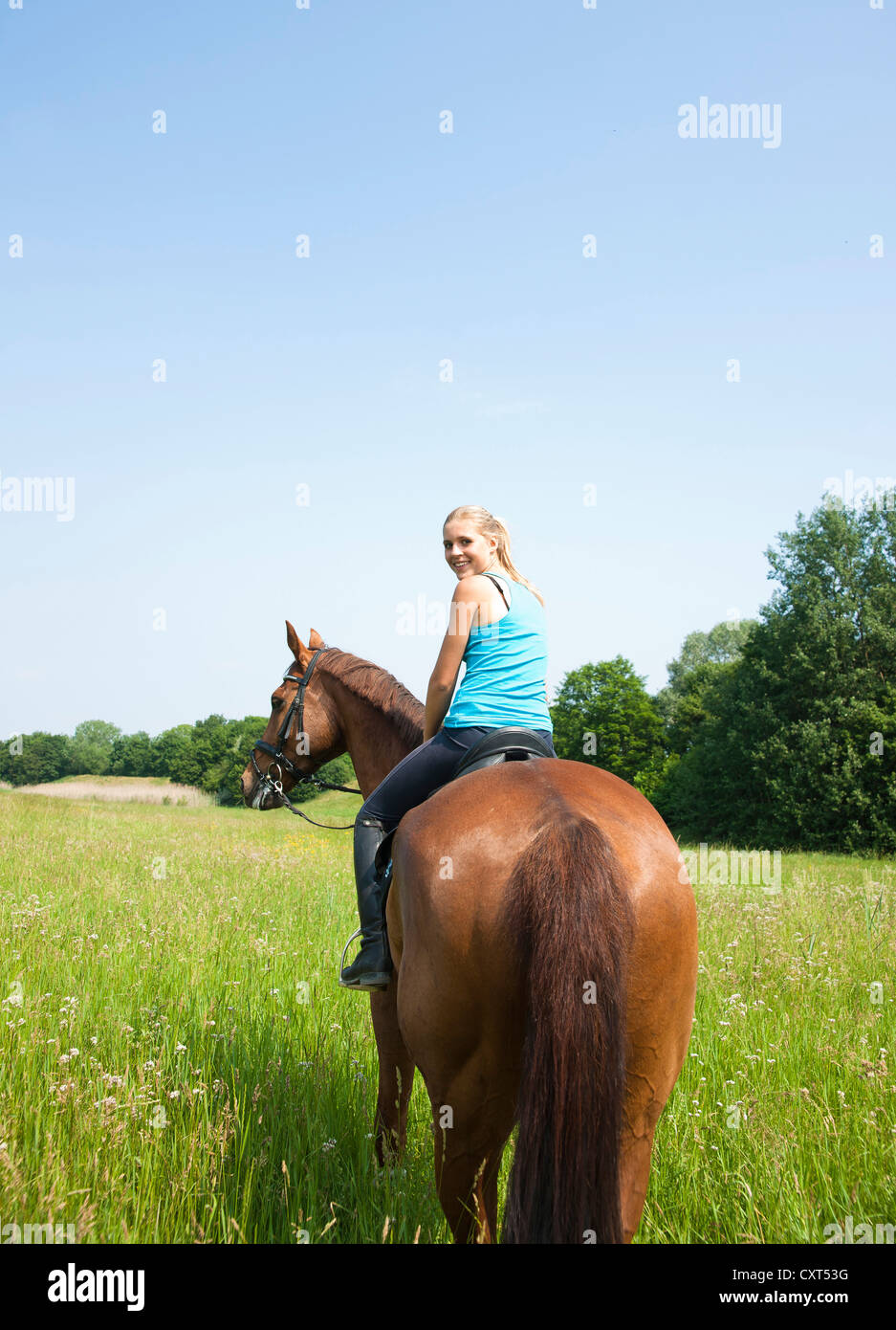 Girl riding a horse Stock Photo - Alamy