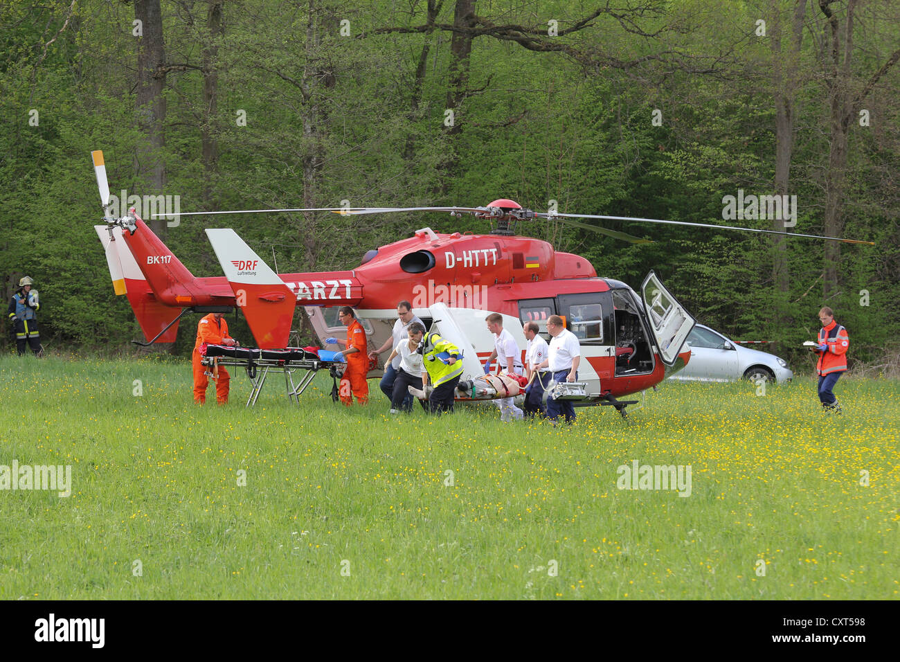 Rescue helicopter in action after aircraft crash in a wooded area at Hahnweide, Kirchheim unter Teck, Baden-Wuerttemberg Stock Photo