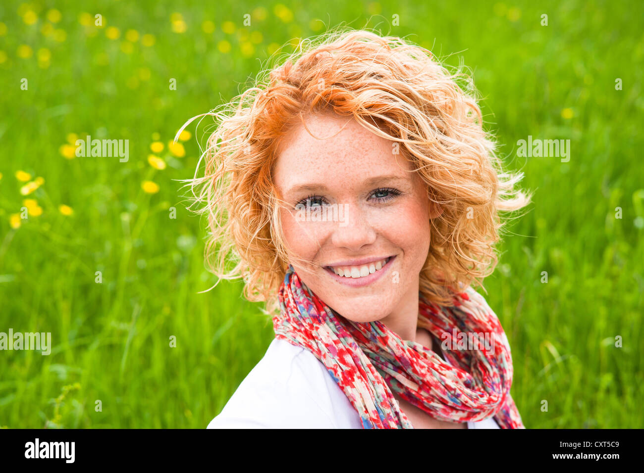 Portrait of a smiling young woman outdoors Stock Photo - Alamy