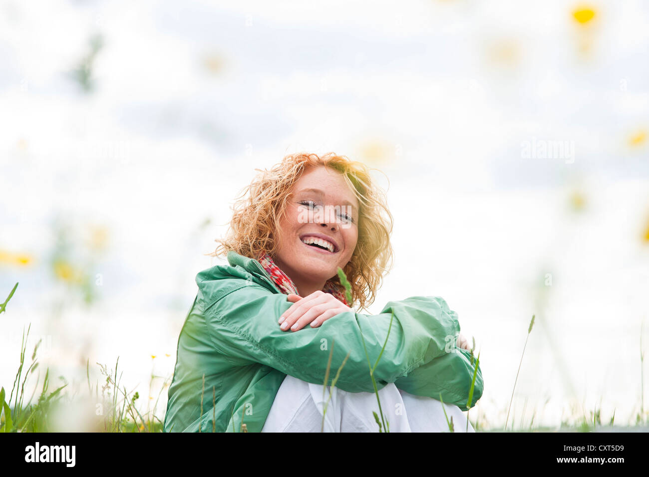 Portrait of a smiling young woman outdoors Stock Photo - Alamy
