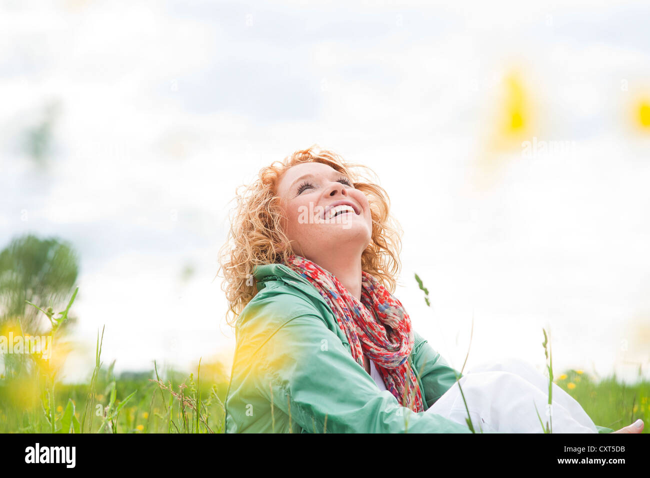 Portrait of a smiling young woman outdoors Stock Photo - Alamy